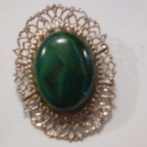 Large cabochon mounted in filigree silver applicad